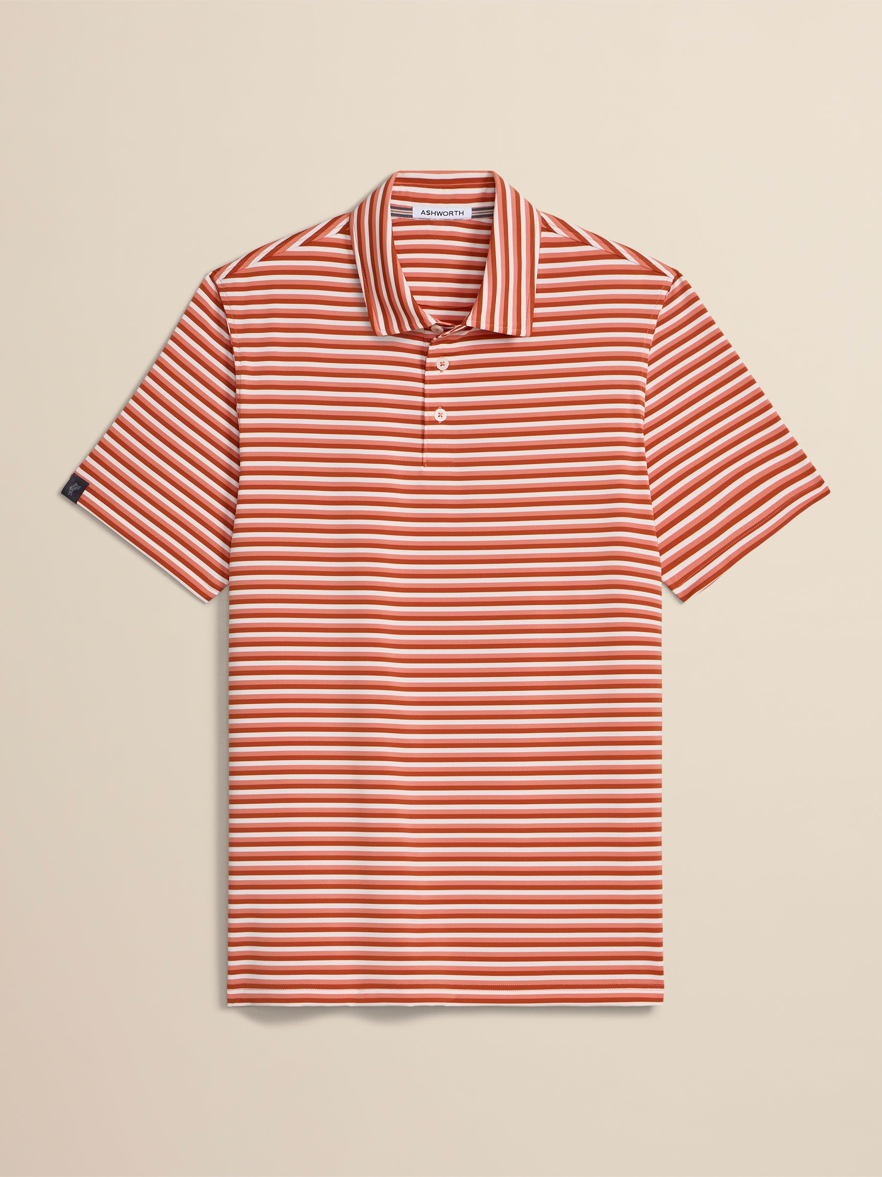 Red and white striped polo shirt on a beige background