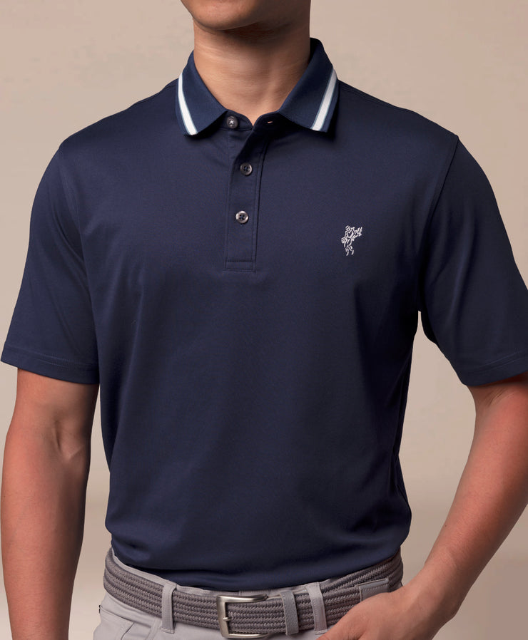 Navy blue polo shirt with a small logo on a beige background