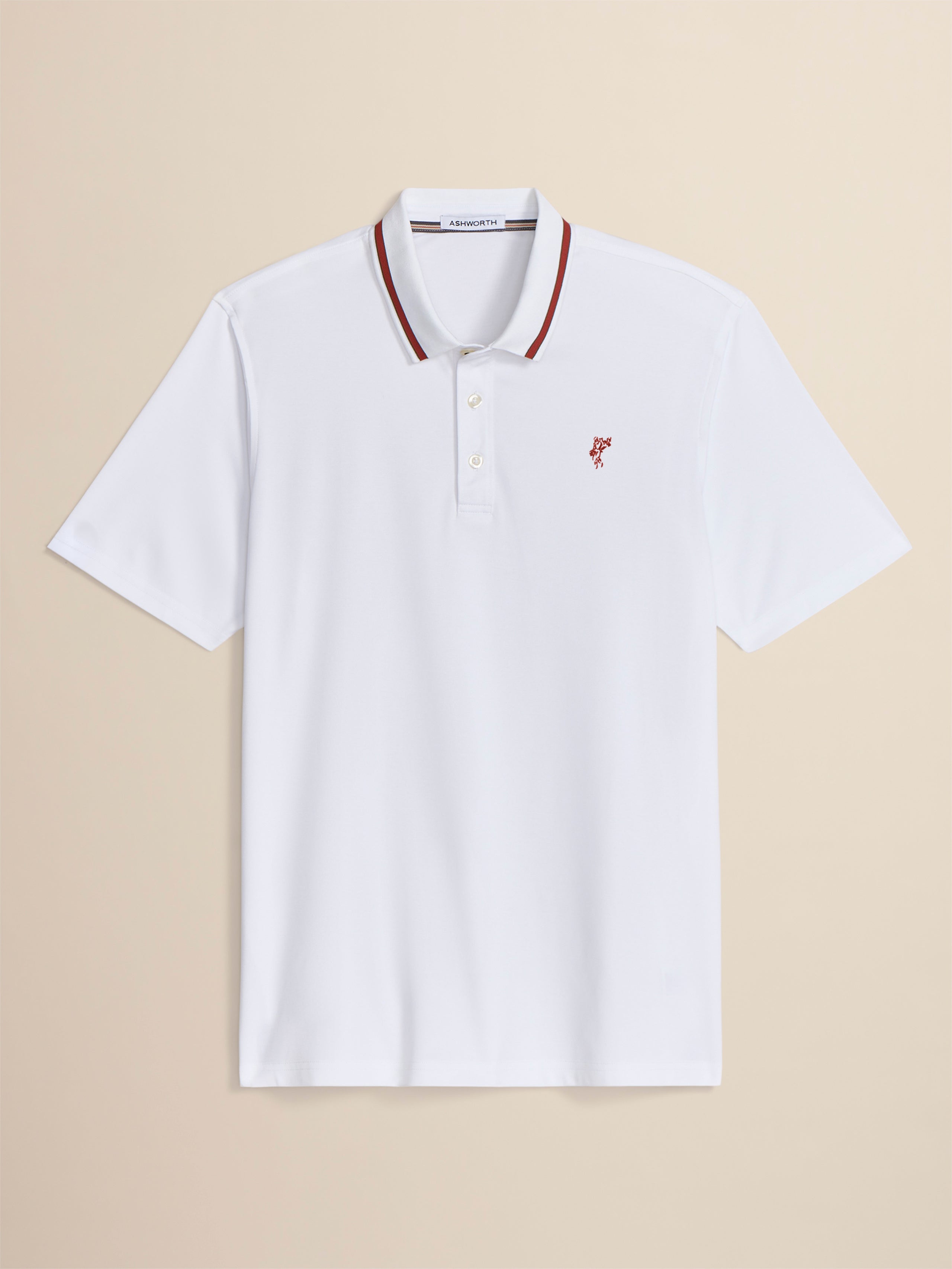 White polo shirt with red accents on a beige background