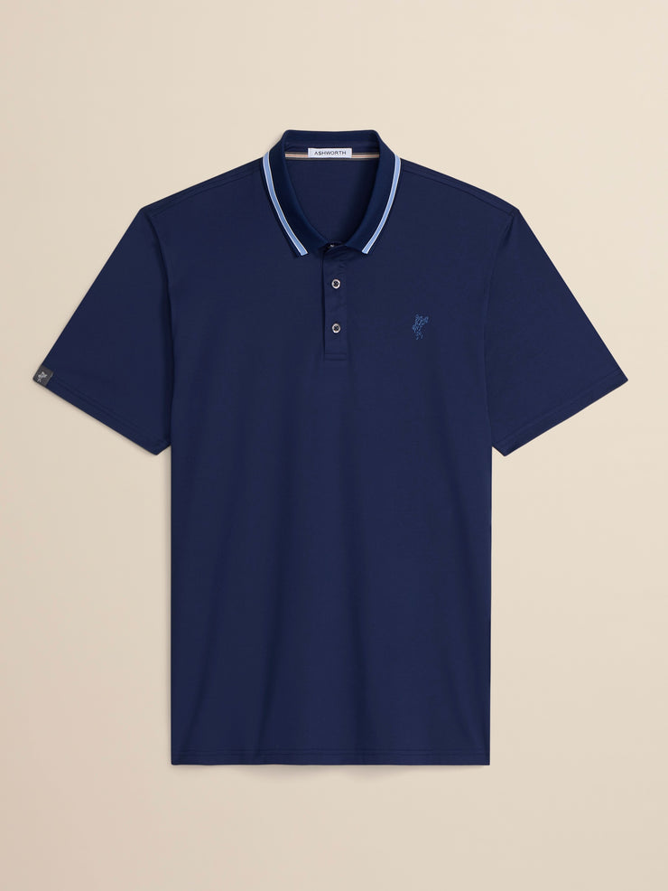 Navy blue polo shirt with white trim on a beige background