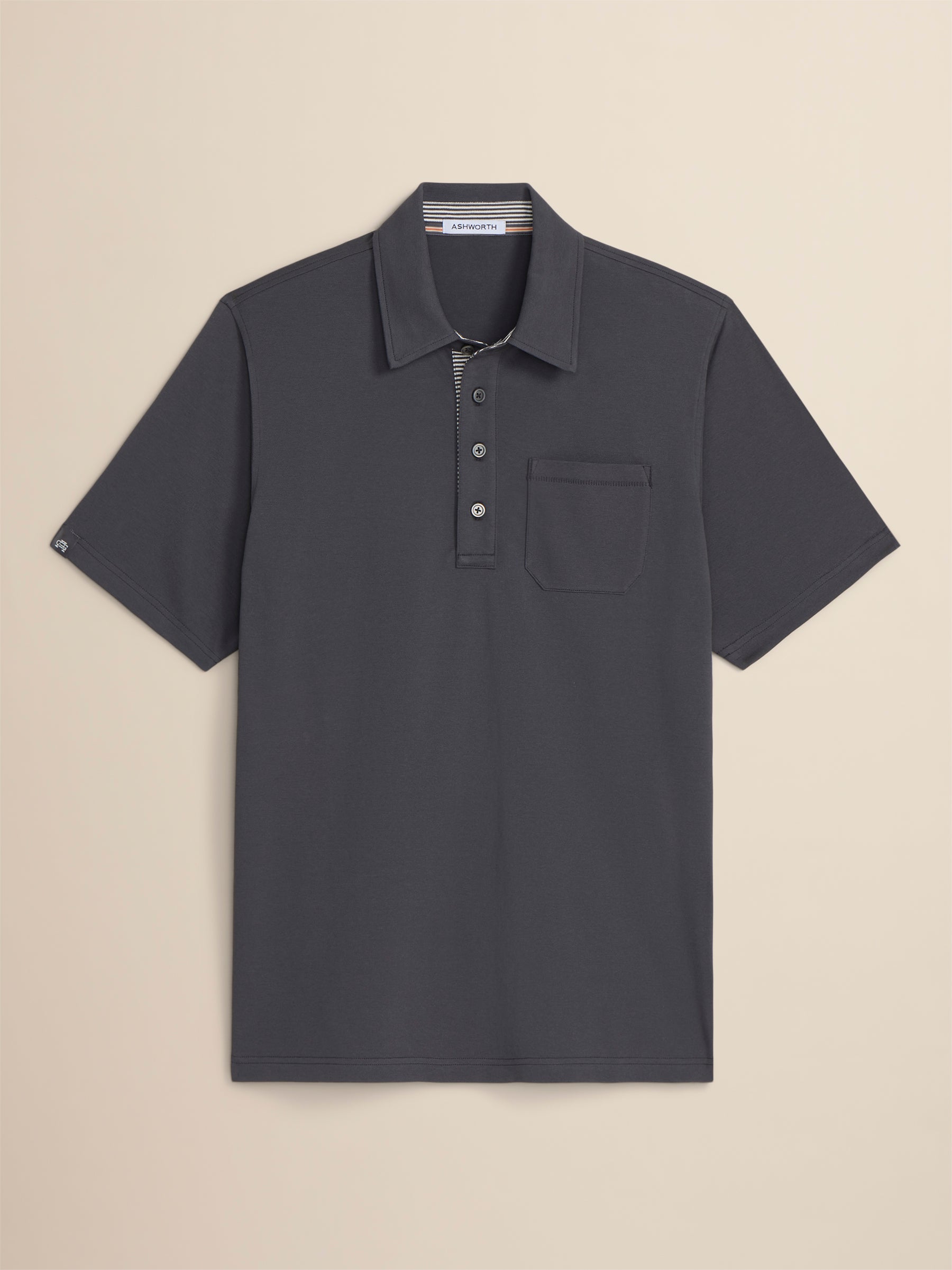 Dark gray polo shirt on a beige background