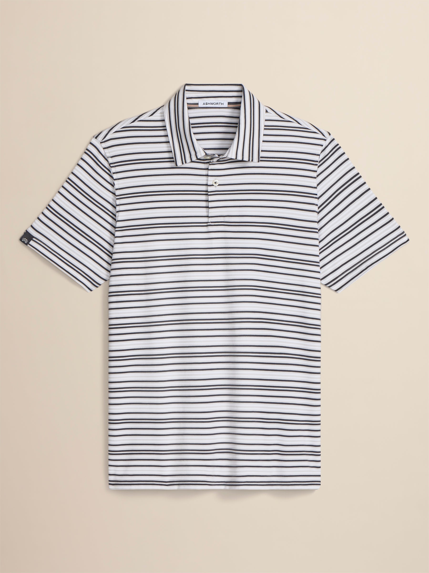Striped polo shirt on a beige background