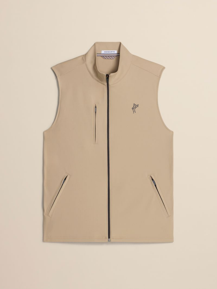 A beige sleeveless zip-front vest with a stand collar, two vertical zip pockets, and a small embroidered bird logo on the left chest, shown on a plain beige background.
