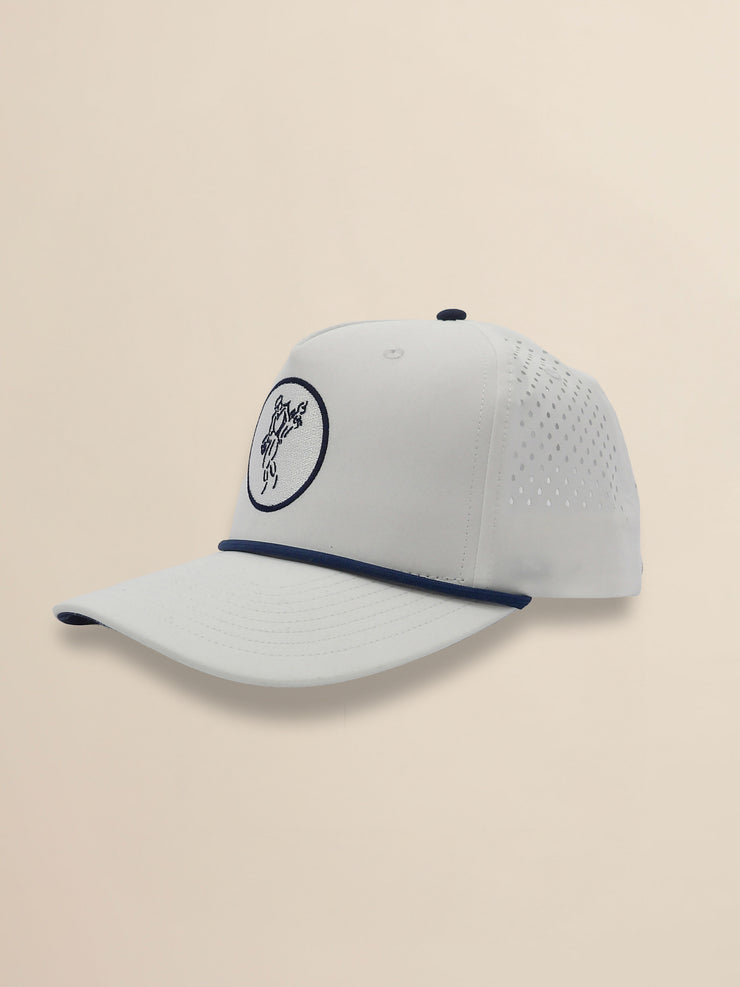 White baseball cap with a logo on a beige background